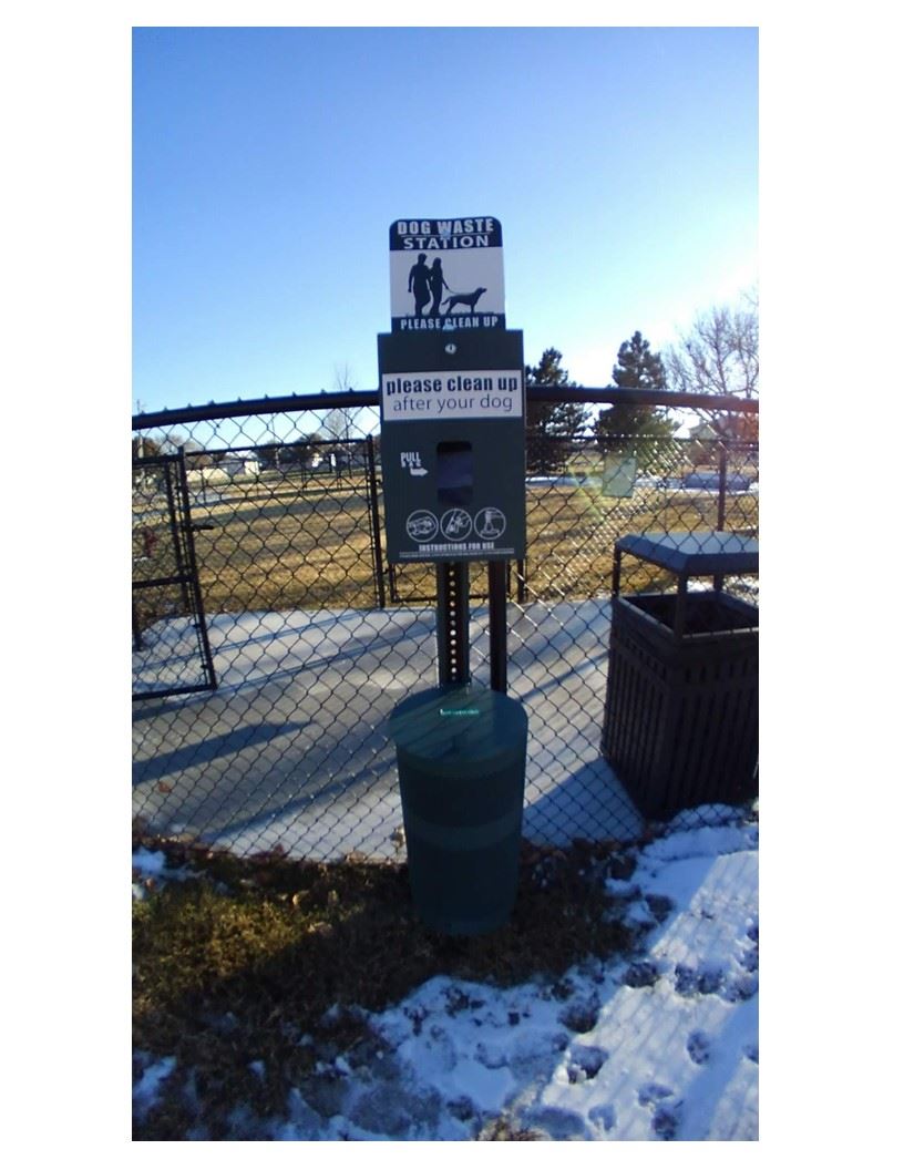 A park sign indicating that dogs are not permitted on the premises